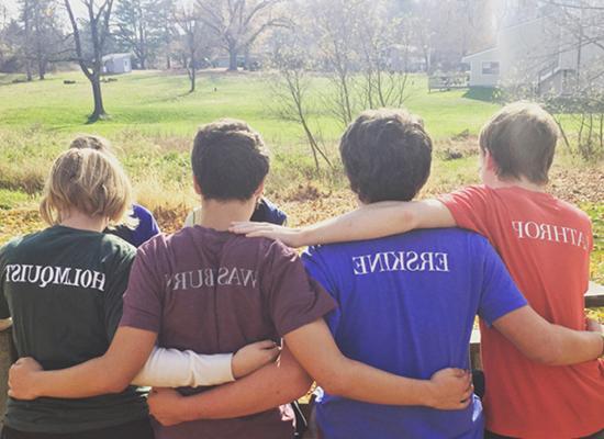 Image from behind of Solebury Students embracing a chain - Solebury School